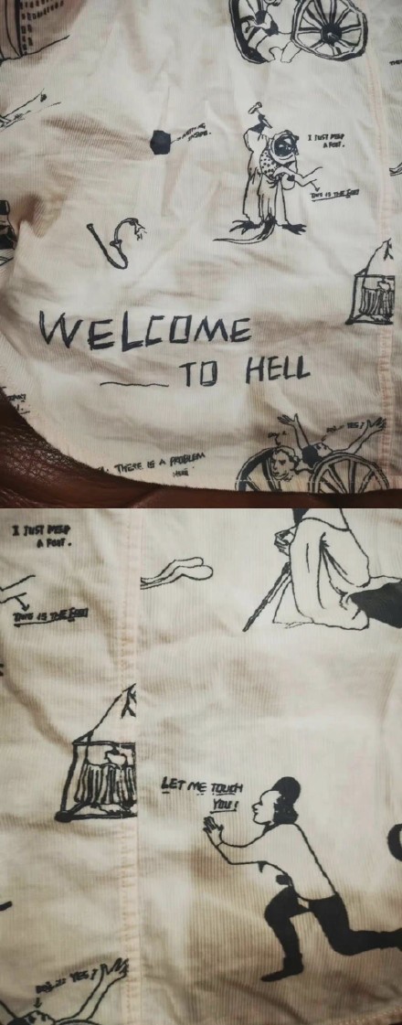 身上的衣服,上面印有"welcome to hell(欢迎来地狱)""let me touch