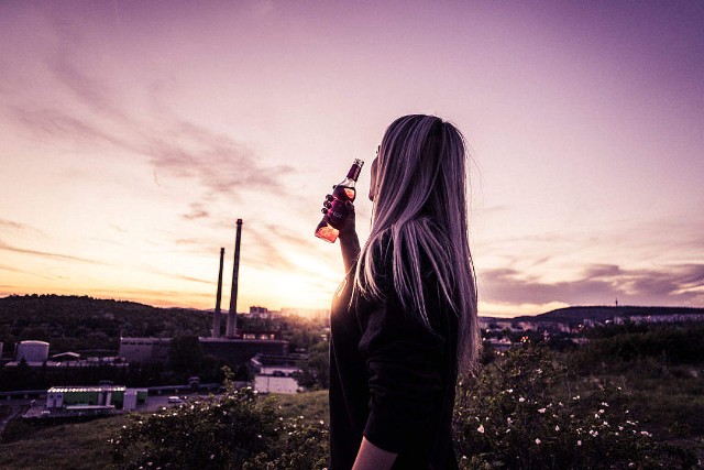 young-woman-enjoying-a-drink-in-sunset-1080x720.jpg